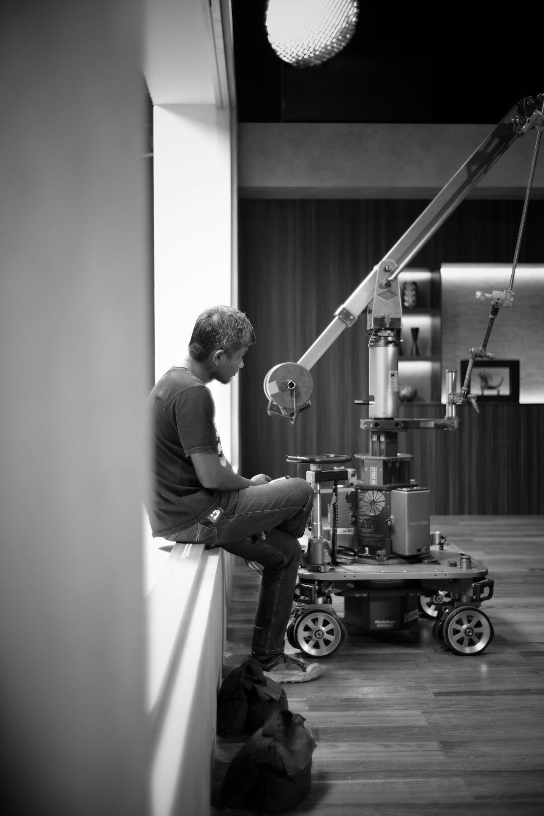 Camera operator filming in a multi-camera television studio